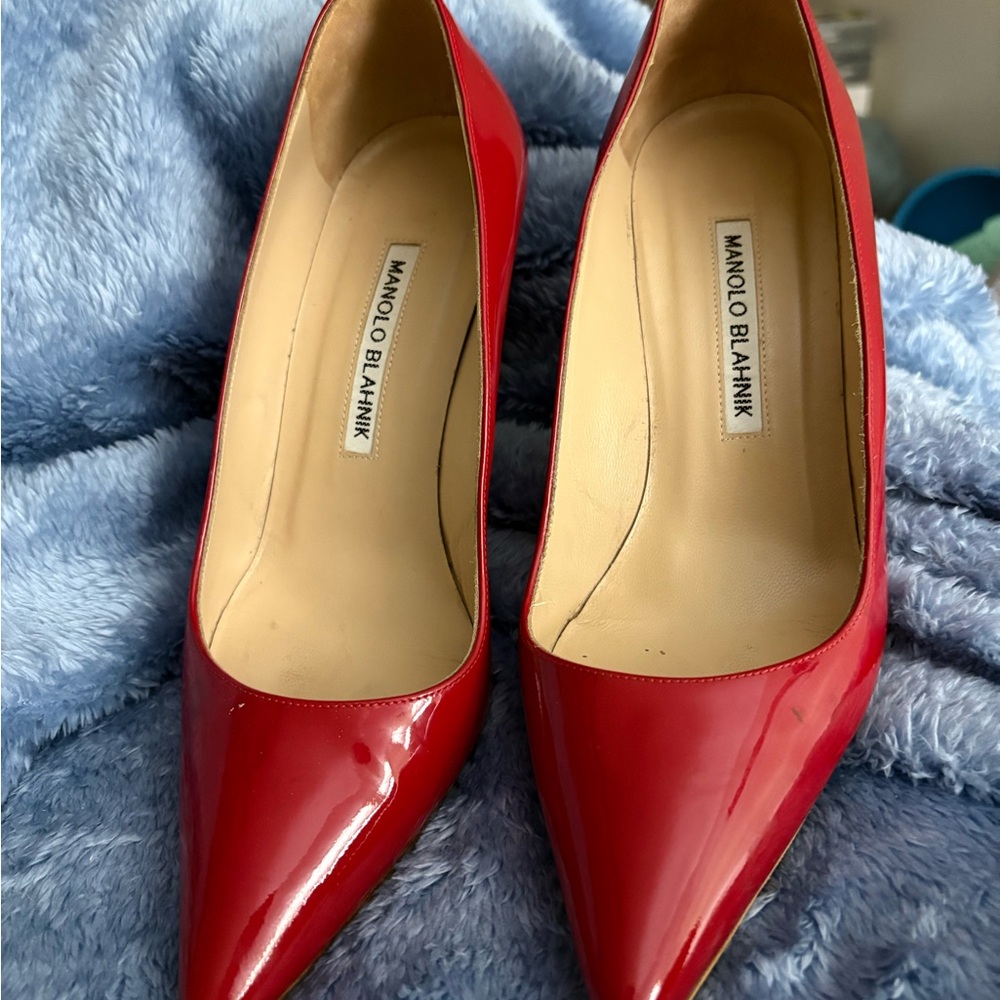 Manolo Blahnik Red Heels with Glossy Patent Leather and Pointed Toe Design